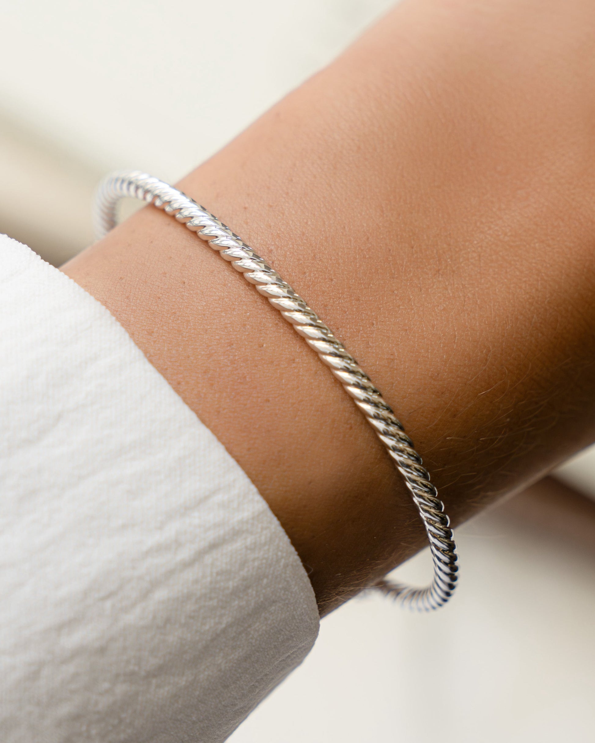 model wearing twisted cuff bracelet