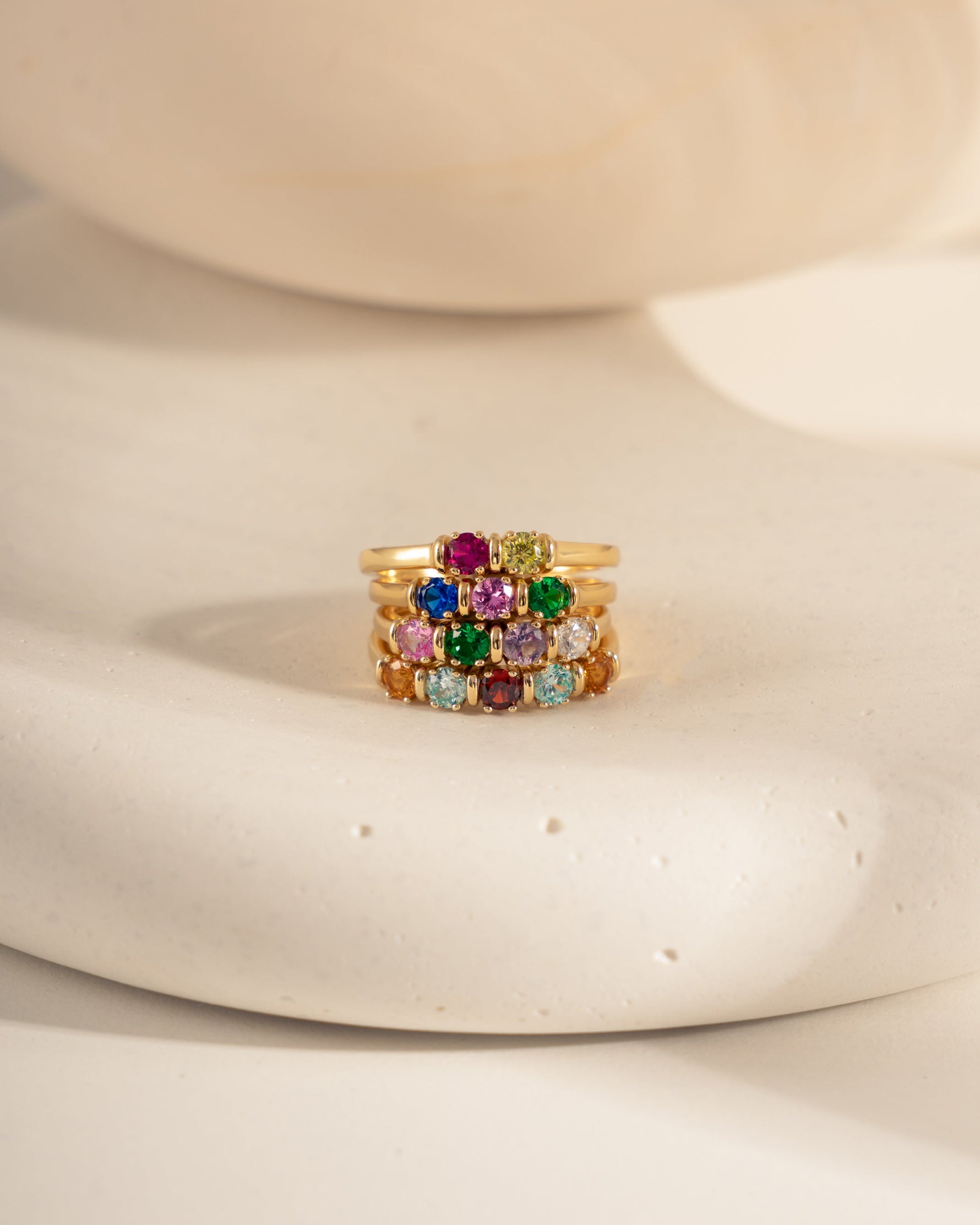 closeup image gold custom birthstone rings 