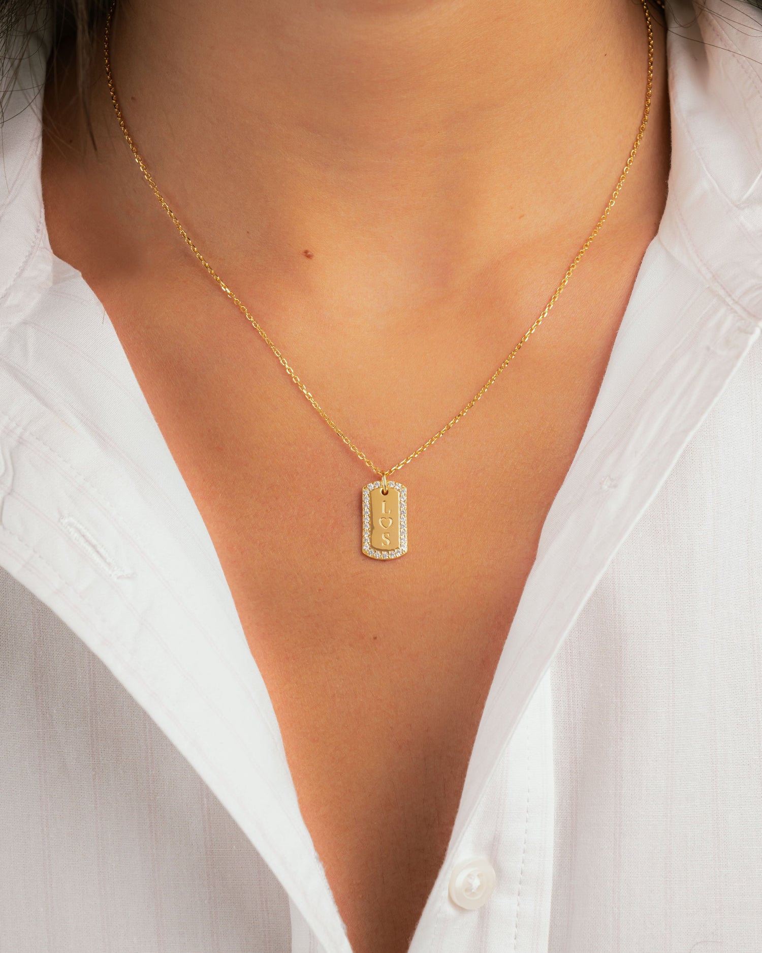 closeup image of model wearing anniversary gift gold necklace