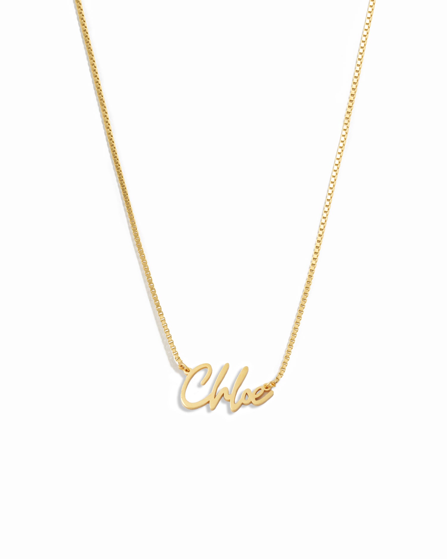 Gold chain custom name necklace with 'chloe' personalized on it, on a white background