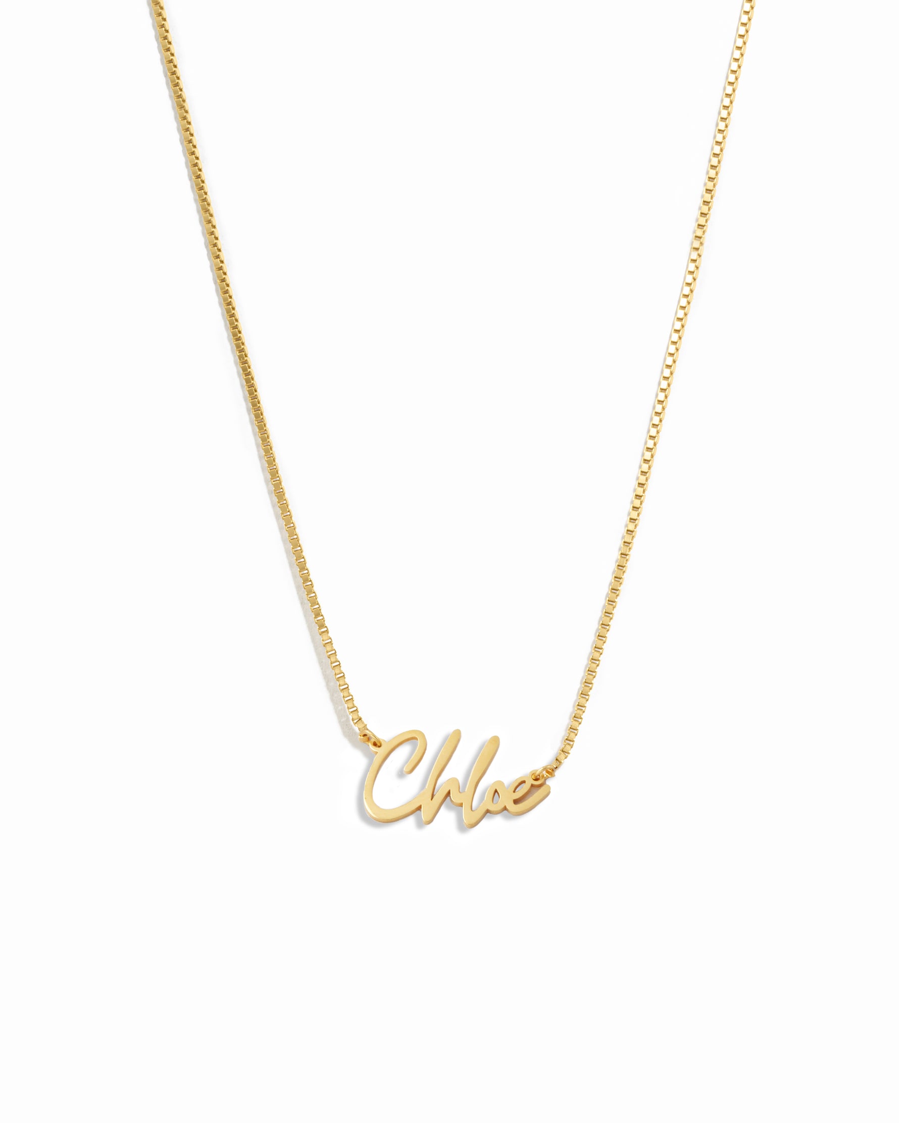 Gold chain custom name necklace with 'chloe' personalized on it, on a white background