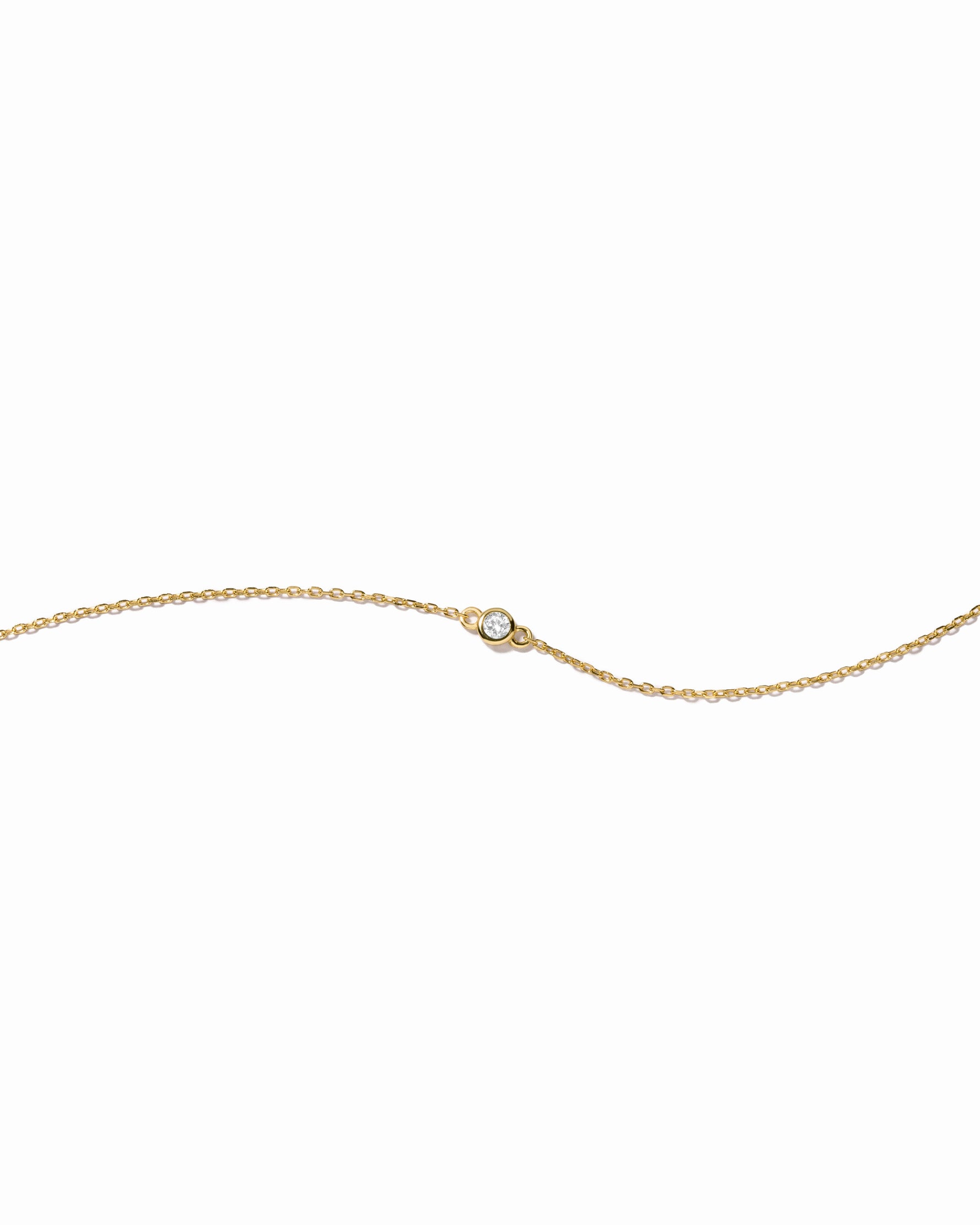 closeup image of dainty bezel stacking bracelet