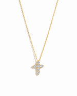Gold necklace with a diamond cross pendant on a white background
