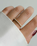 Model wearing gold wedding band 