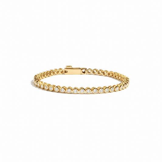 Round bezel tennis bracelet in gold