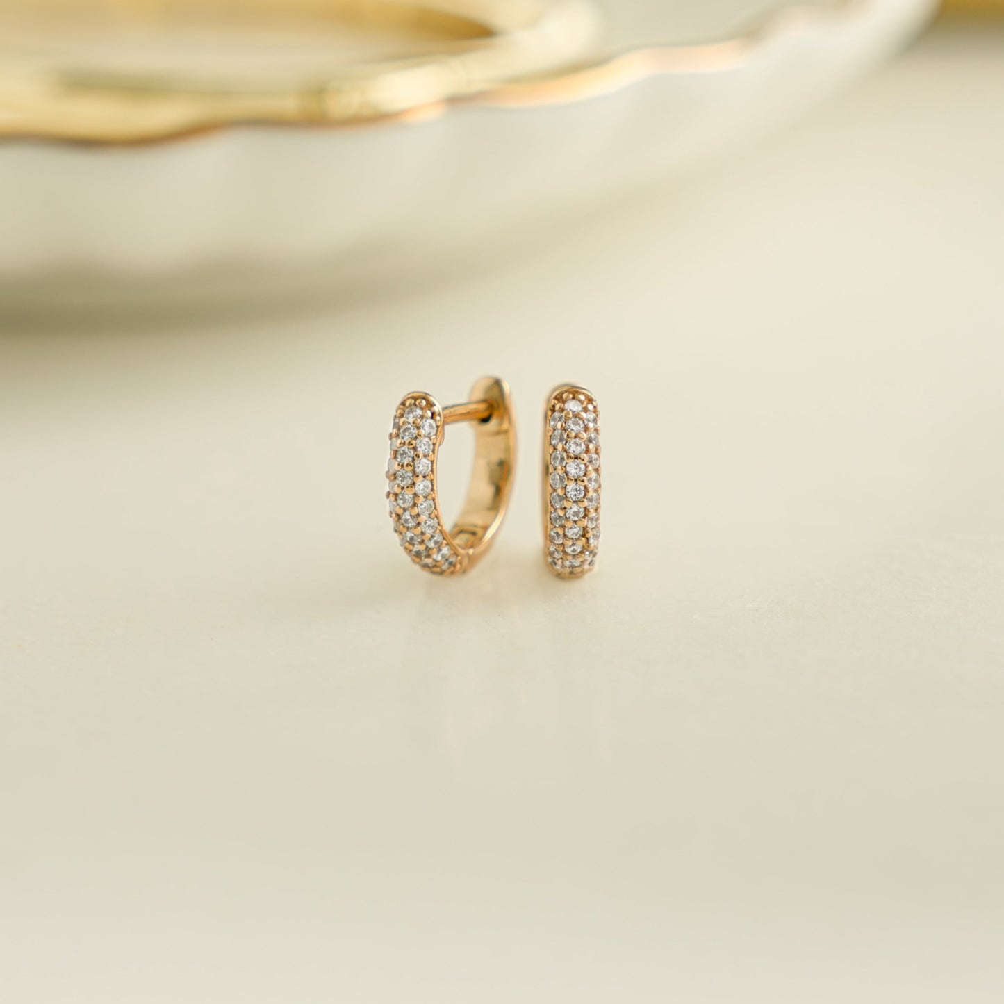 image of dainty gold small hoop earrings