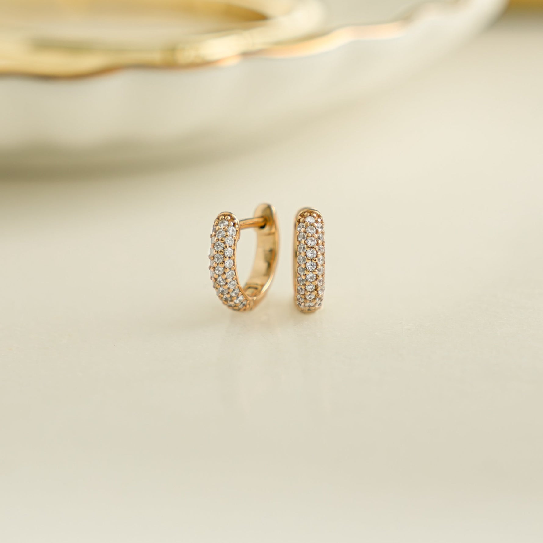 image of dainty gold small hoop earrings