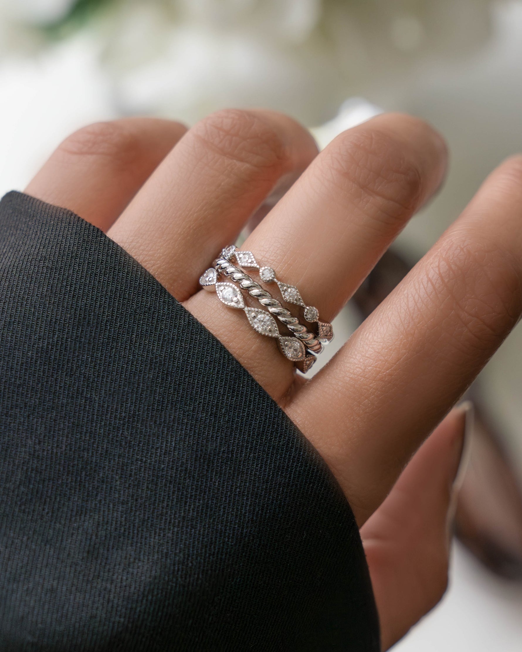 Model wearing 925 sterling silver jewelry set featuring silver stackable rings 