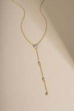 Gold bridal jewelry featuring a gold chain lariat necklace