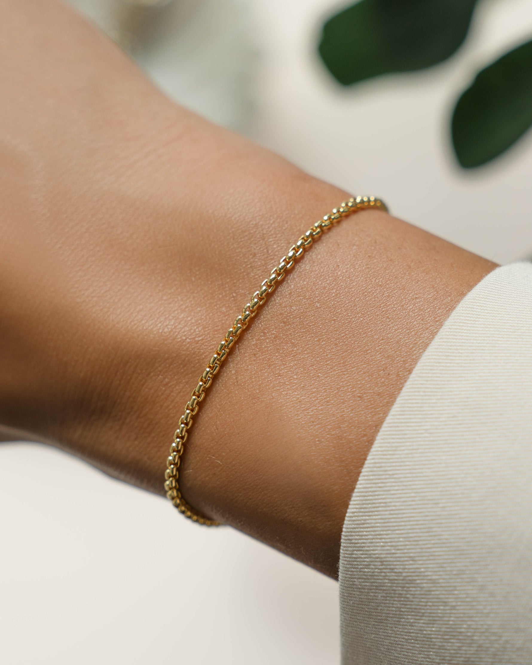 Gold box chain bracelet on model