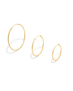 simple gold hoops on a white background showcasing the different sizes the come in