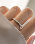 Gold diamond wedding band on model