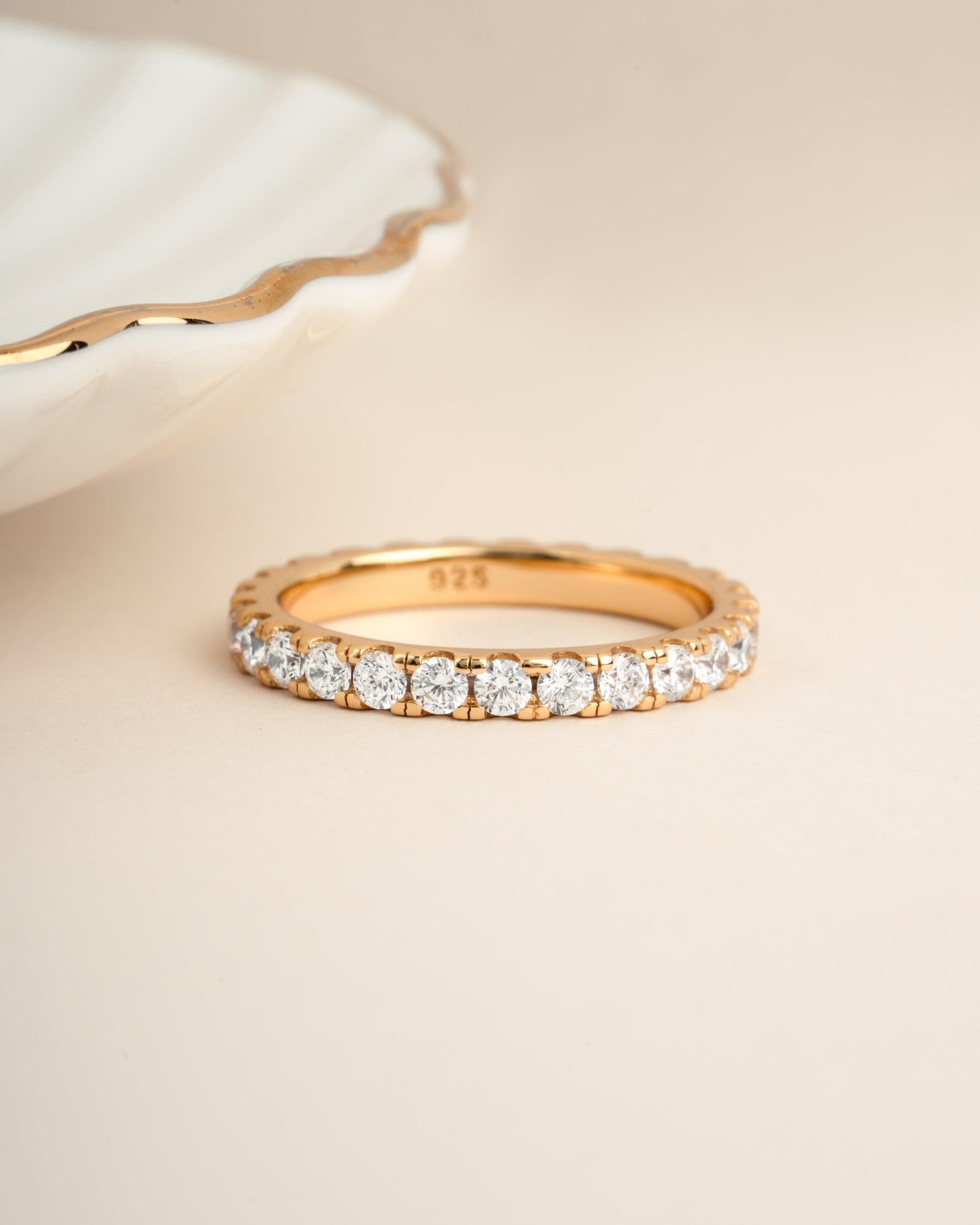 A gold dainty wedding ring