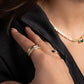 model wearing statement jewelry featuring chunky gold ring