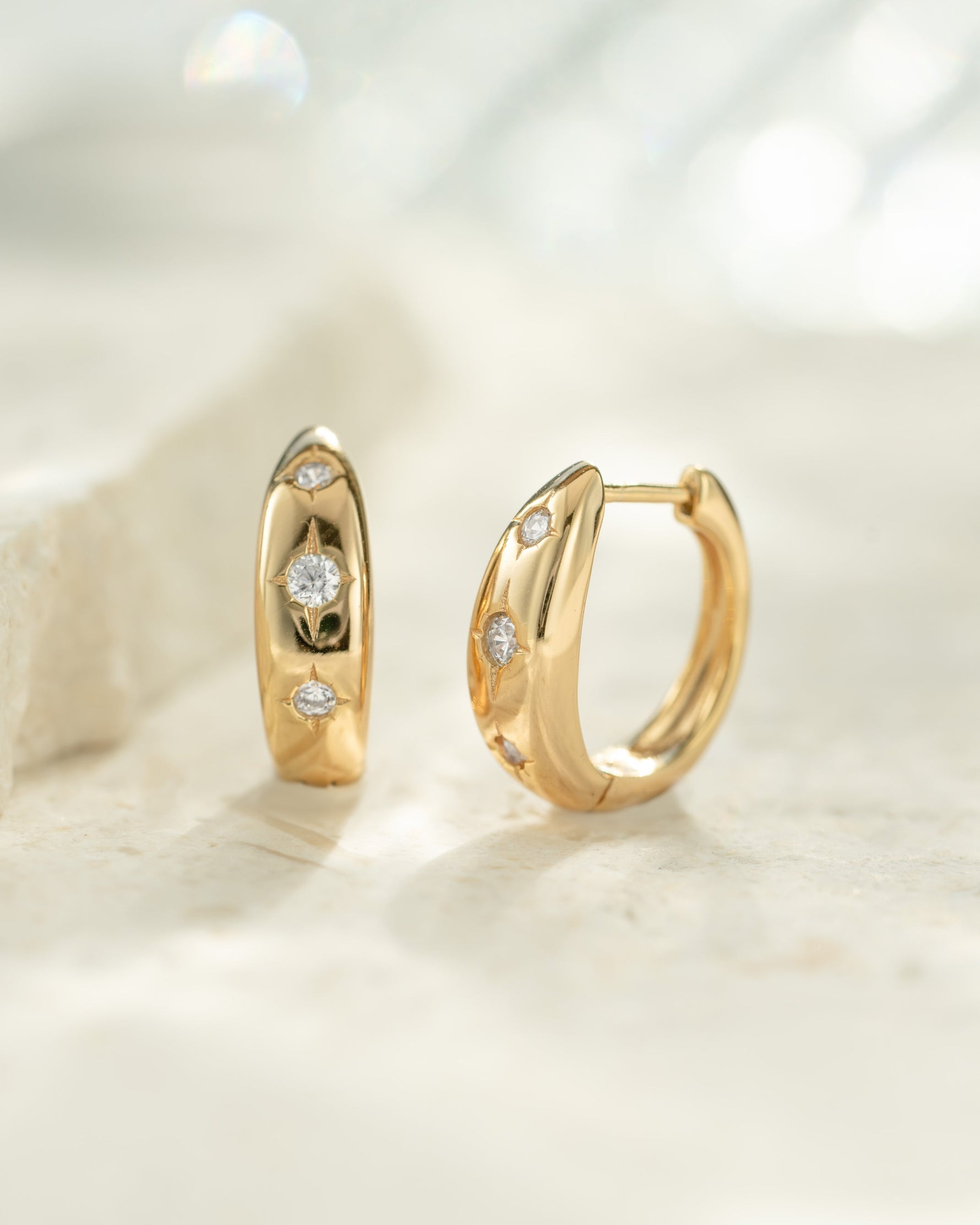 Gold huggie hoop star earrings