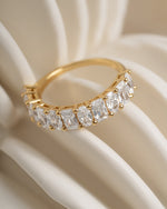 Gold diamond ring with emerald cut and oval cut cubic zirconia stones 