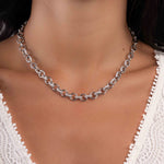Model wearing diamond necklace featuring chunky chain design