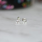 closeup image of sterling silver cluster stud earrings
