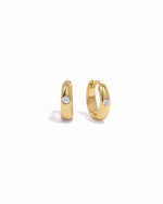 gold small hoop earrings with a cz stone