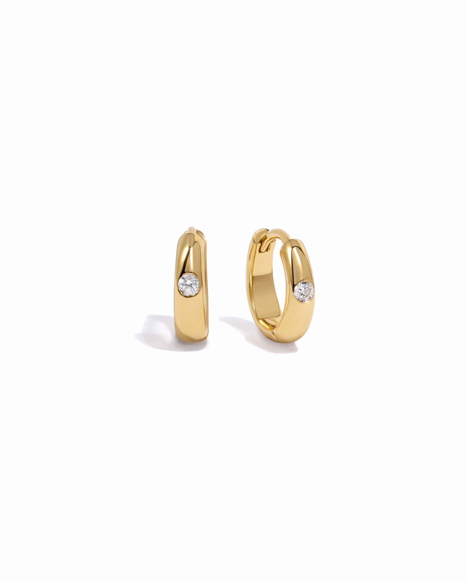 gold small hoop earrings with a cz stone