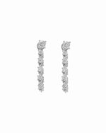 Pair of 925 sterling silver diamond line earrings on a white background