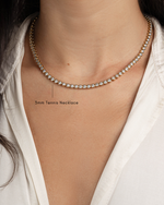 model wearing simple tennis necklace