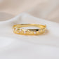 closeup image of thick bangle bracelet with studded pearl design
