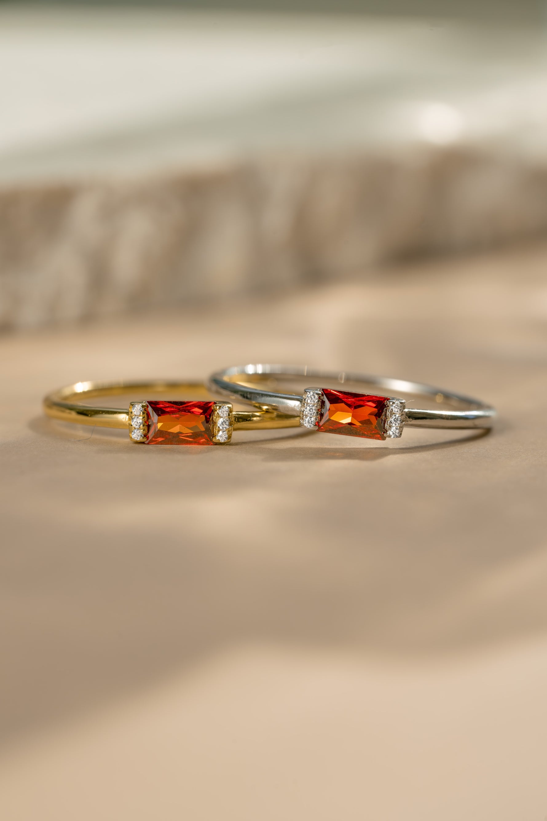 Gold and sterling silver stackable rings featuring the 