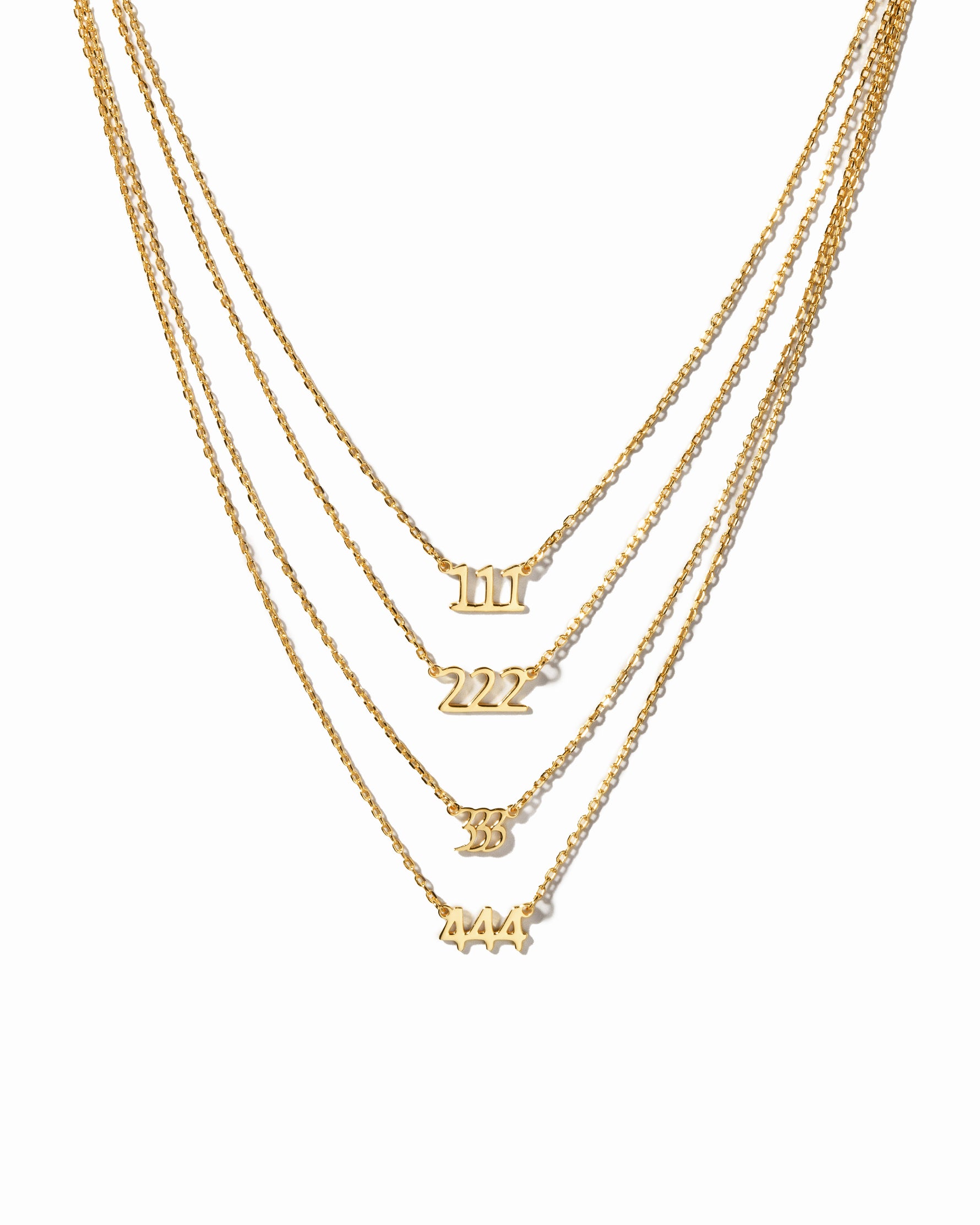 Gold angel number necklaces showcasing the different angel numbers 