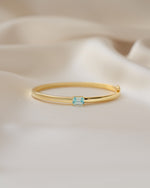 Aquamarine jewelry featuring a gold aquamarine bracelet with a baguette stone 