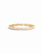 Closeup image of gold tennis bracelet