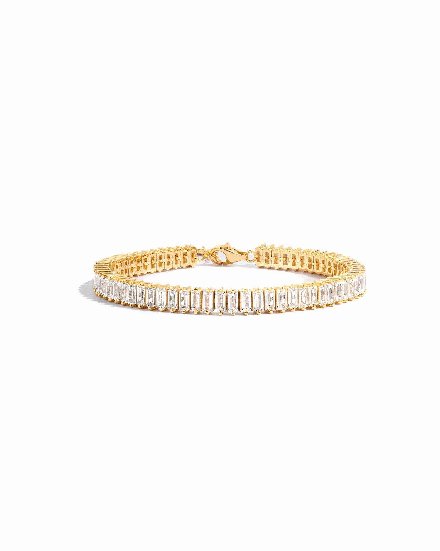 Closeup image of gold tennis bracelet