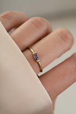 Model wearing gold amethyst birthstone ring