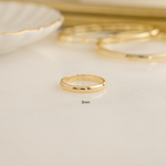 a close up image of a gold plated over 925 sterling silver stacking ring