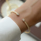 model wearing gold bangle bracelet