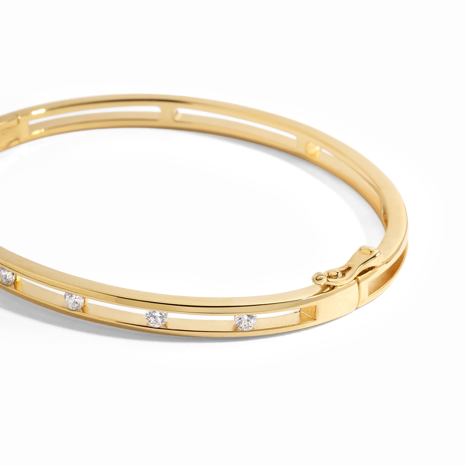 closeup image of gold studded bangle bracelet