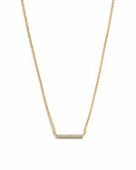 Gold necklace with a bar pendant on a white background