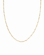 closeup image of white beaded necklace 