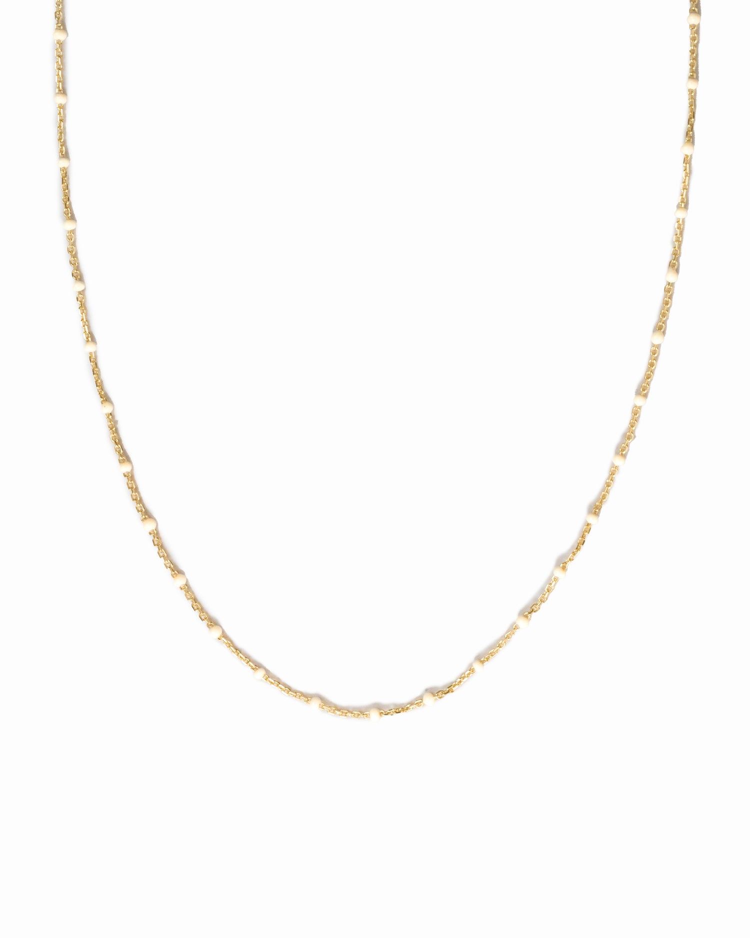 closeup image of white beaded necklace 