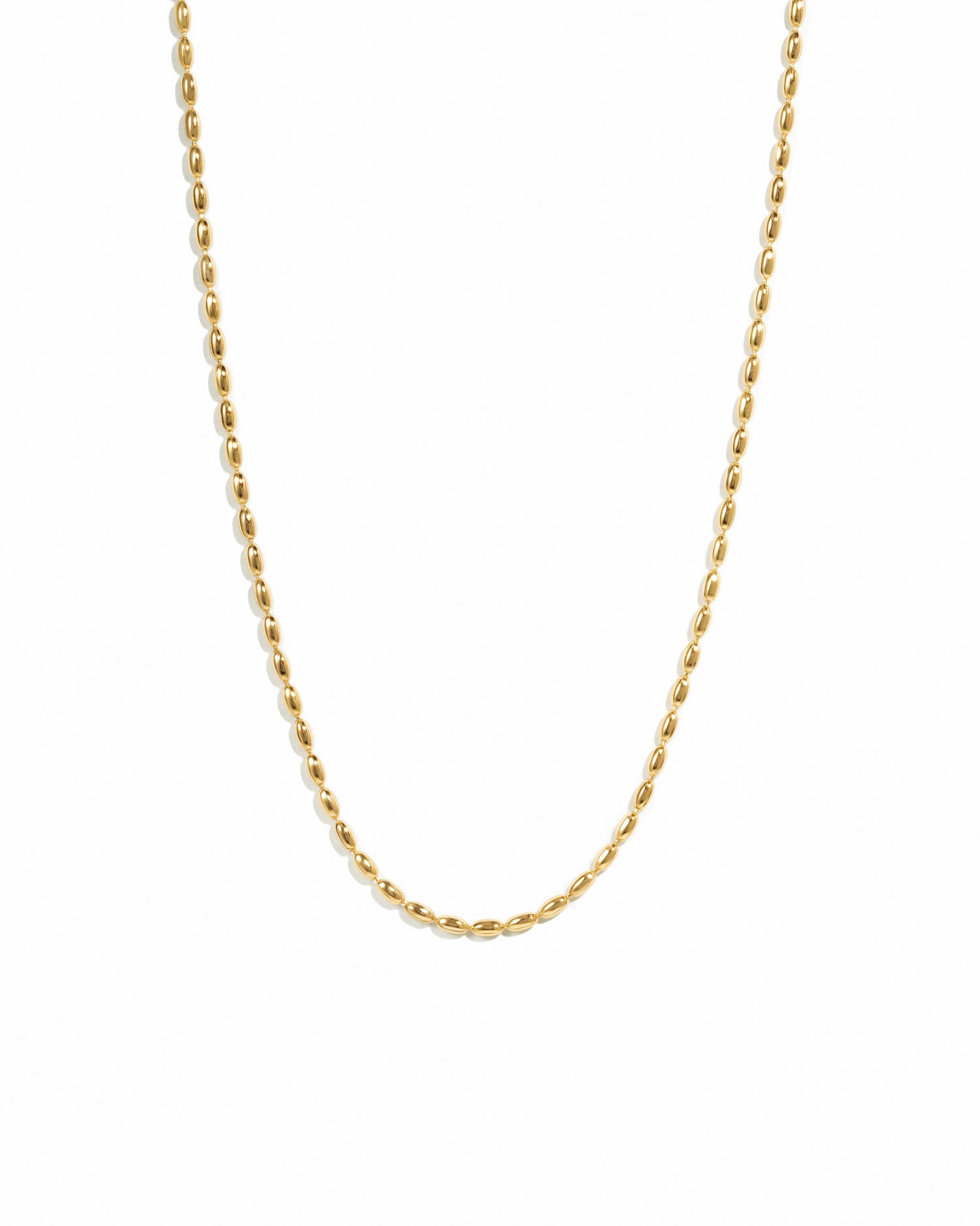 closeup image of gold rice beaded chain necklace