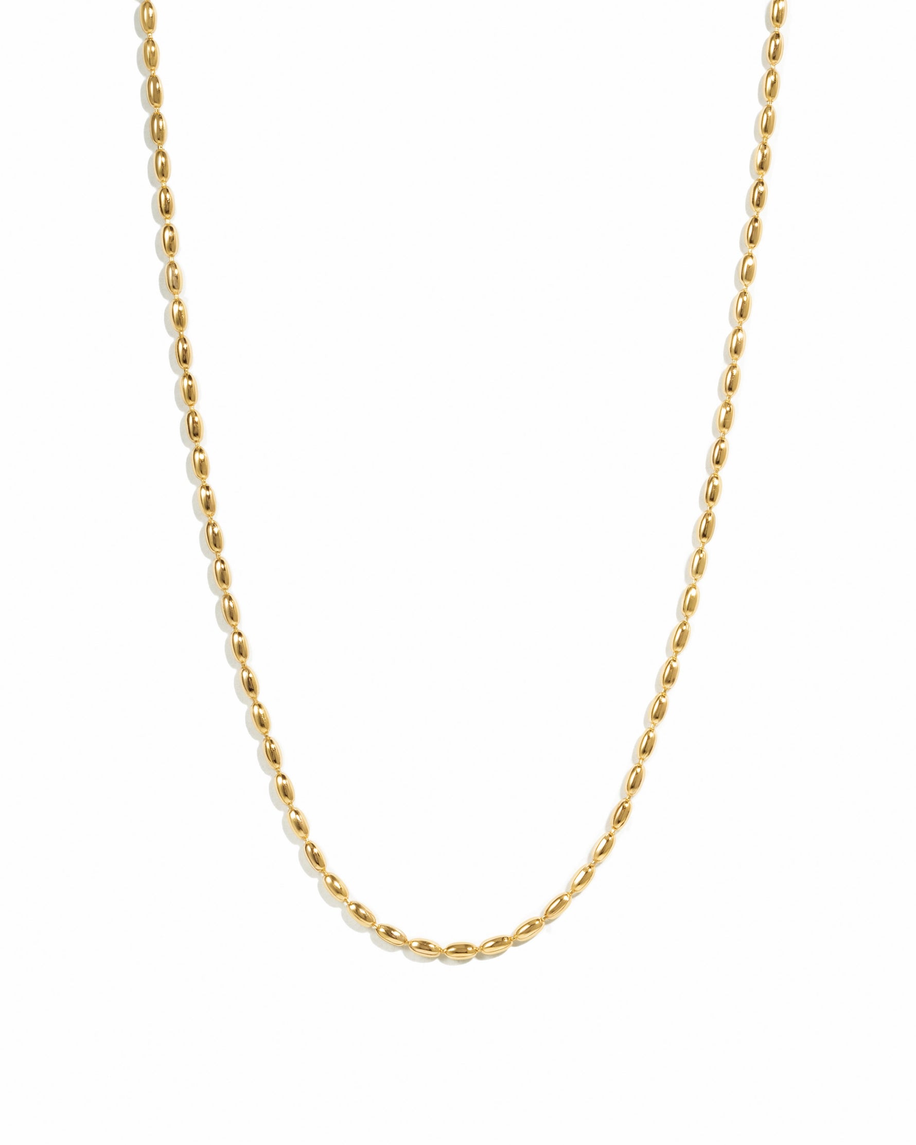 closeup image of gold rice beaded chain necklace