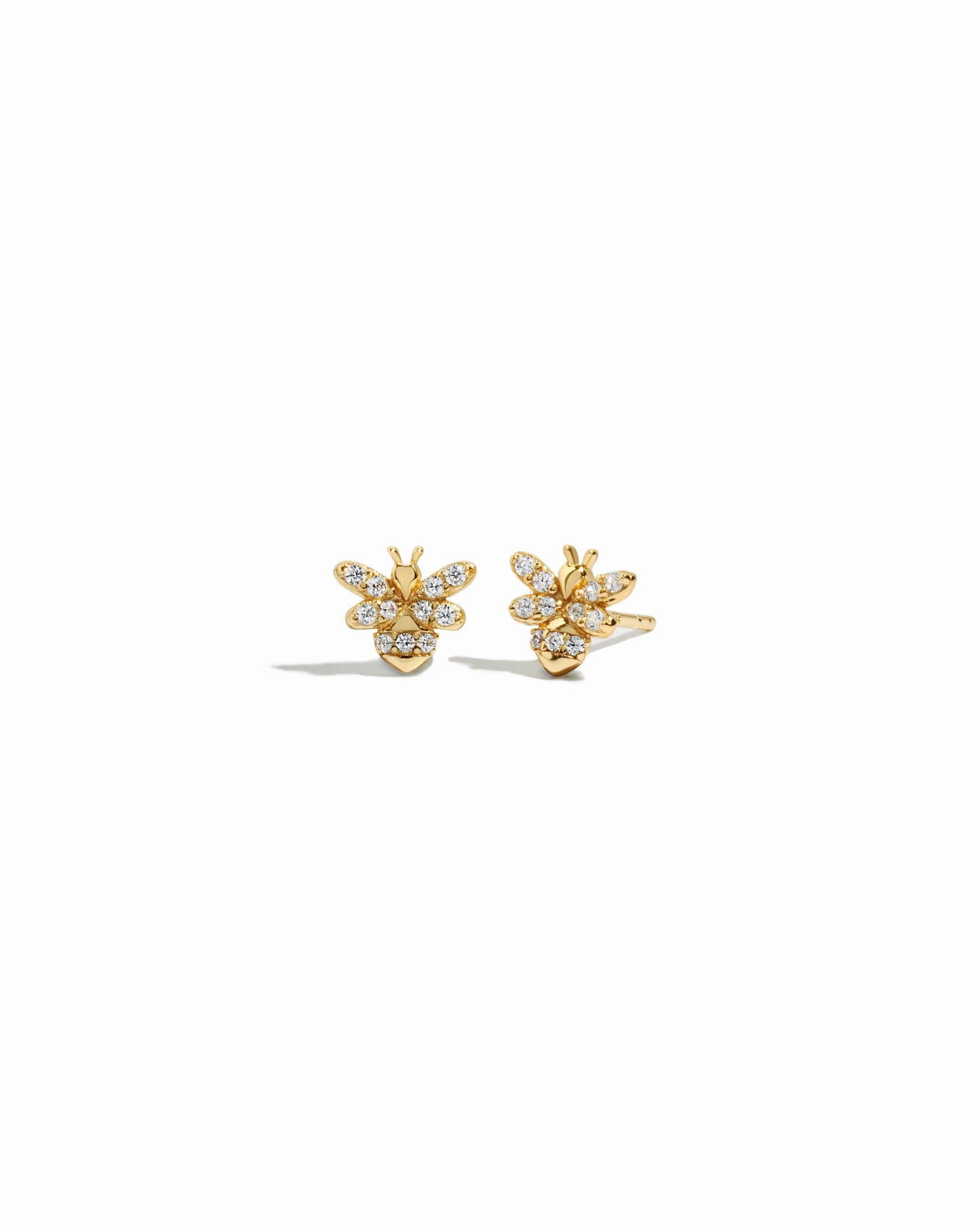 closeup image of vintage jewelry featuring tiny stud bee earrings