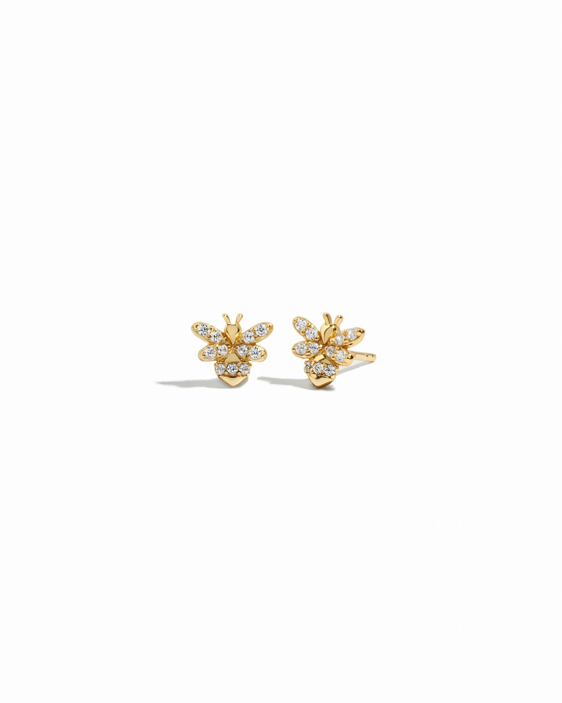 closeup image of vintage jewelry featuring tiny stud bee earrings
