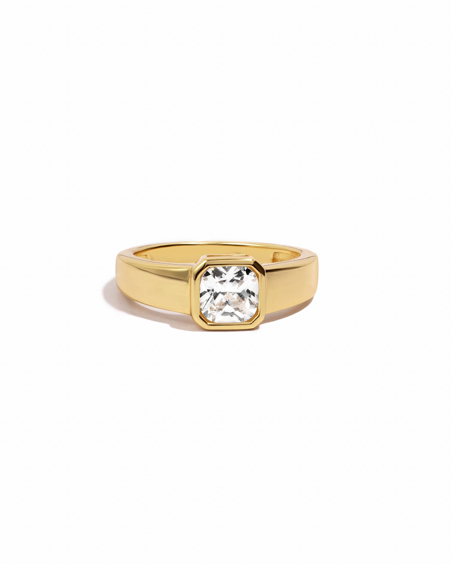 Gold square dome ring on a white background