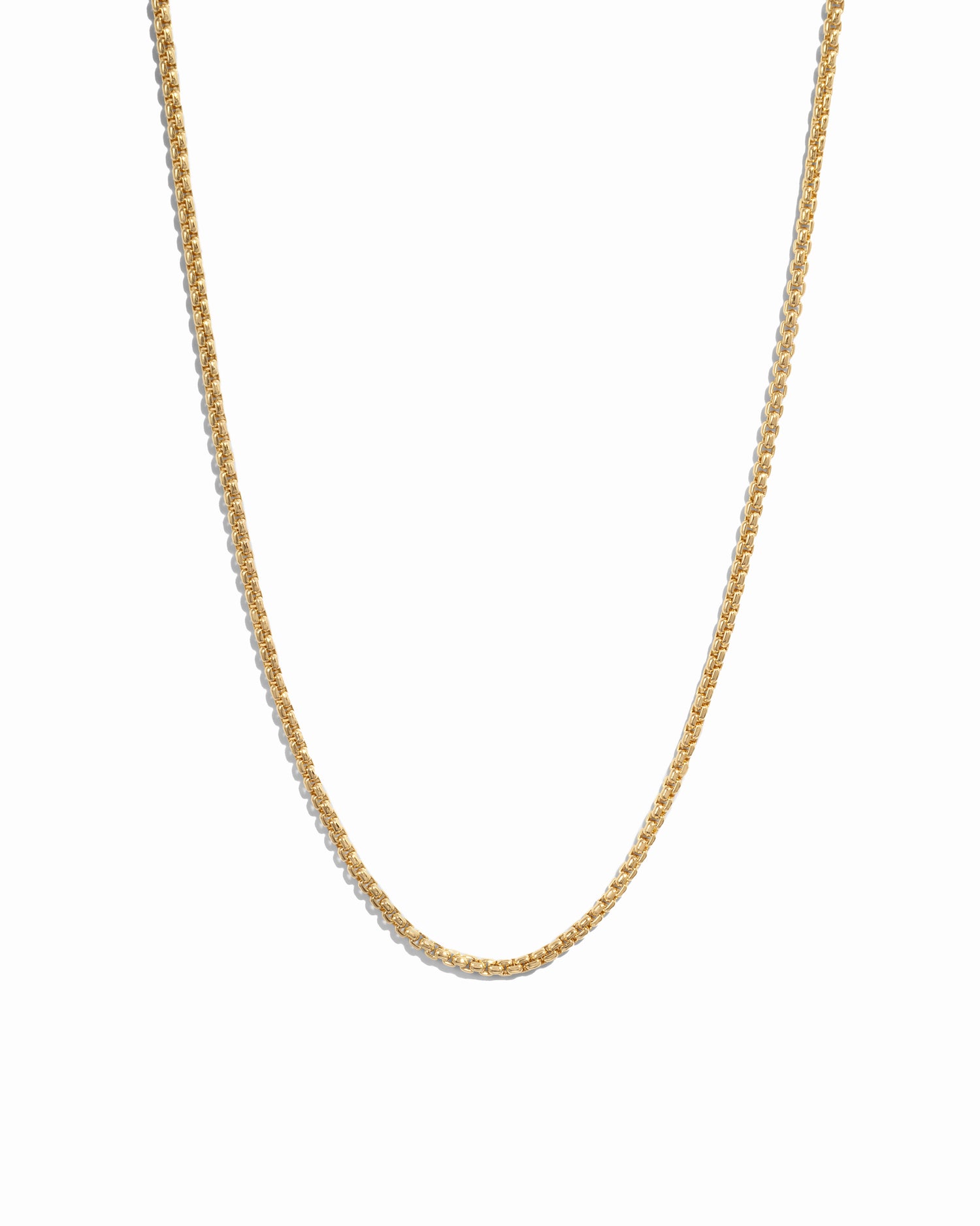 Gold chain necklace on a white background