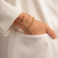 model wearing diamond paperclip bracelet stack