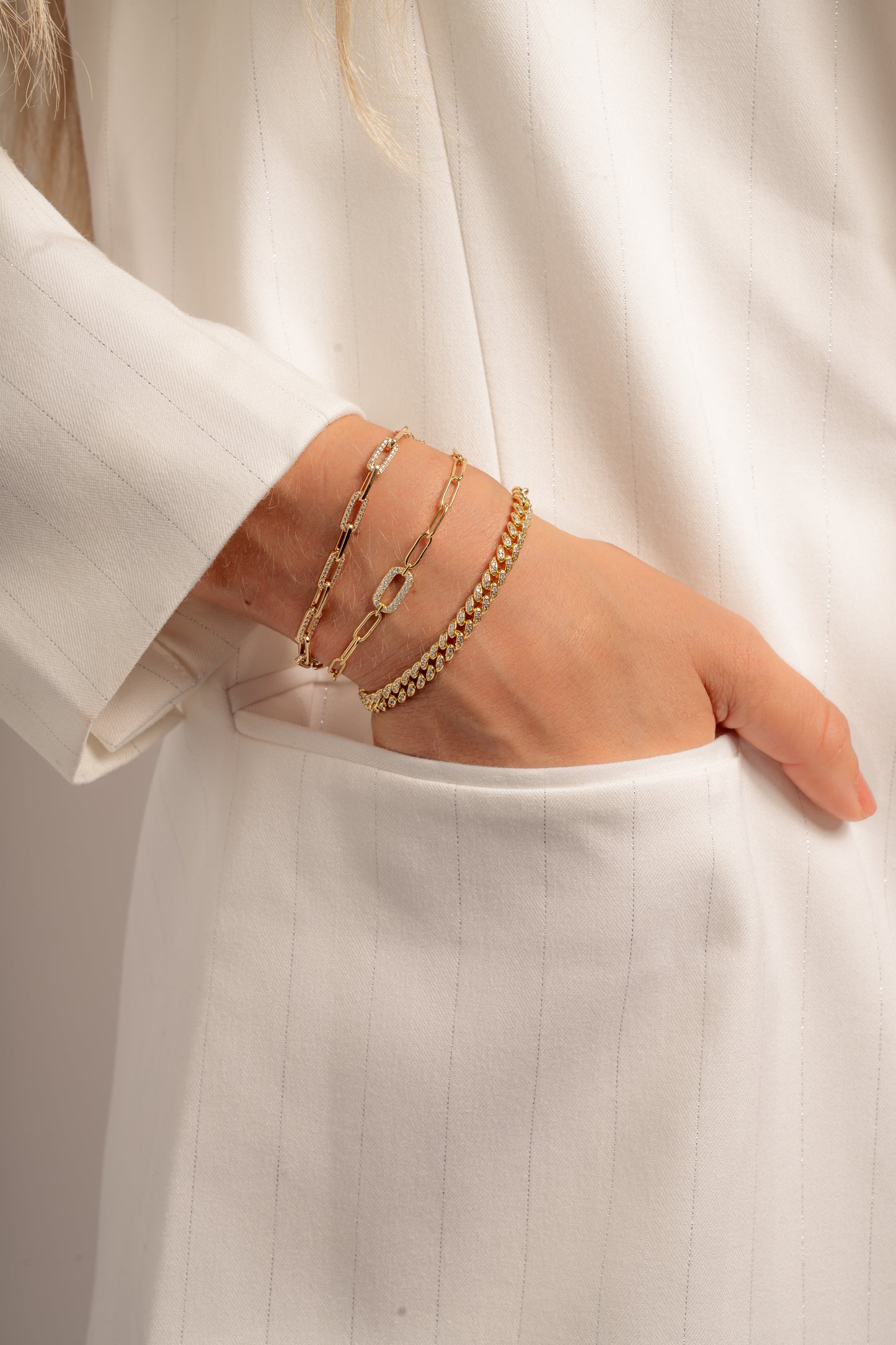model wearing diamond paperclip bracelet stack