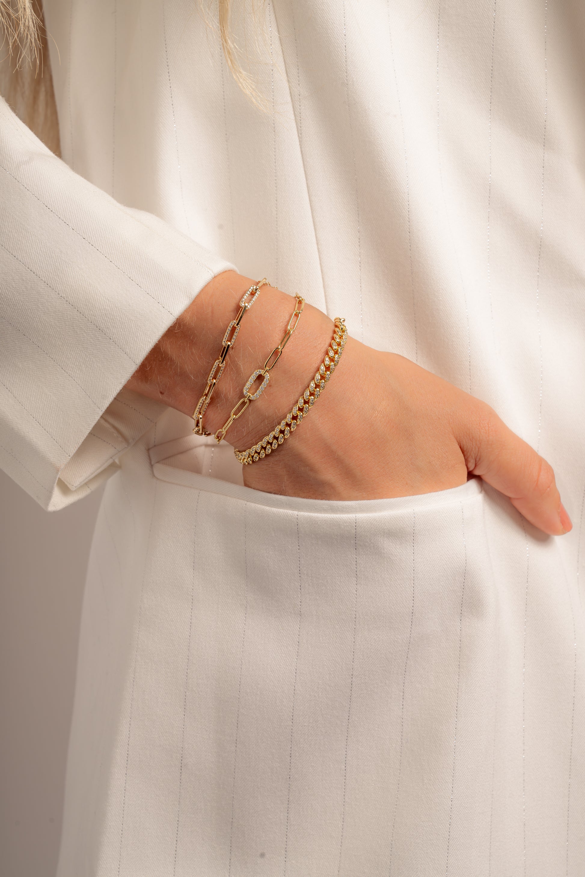 model wearing diamond paperclip bracelet stack