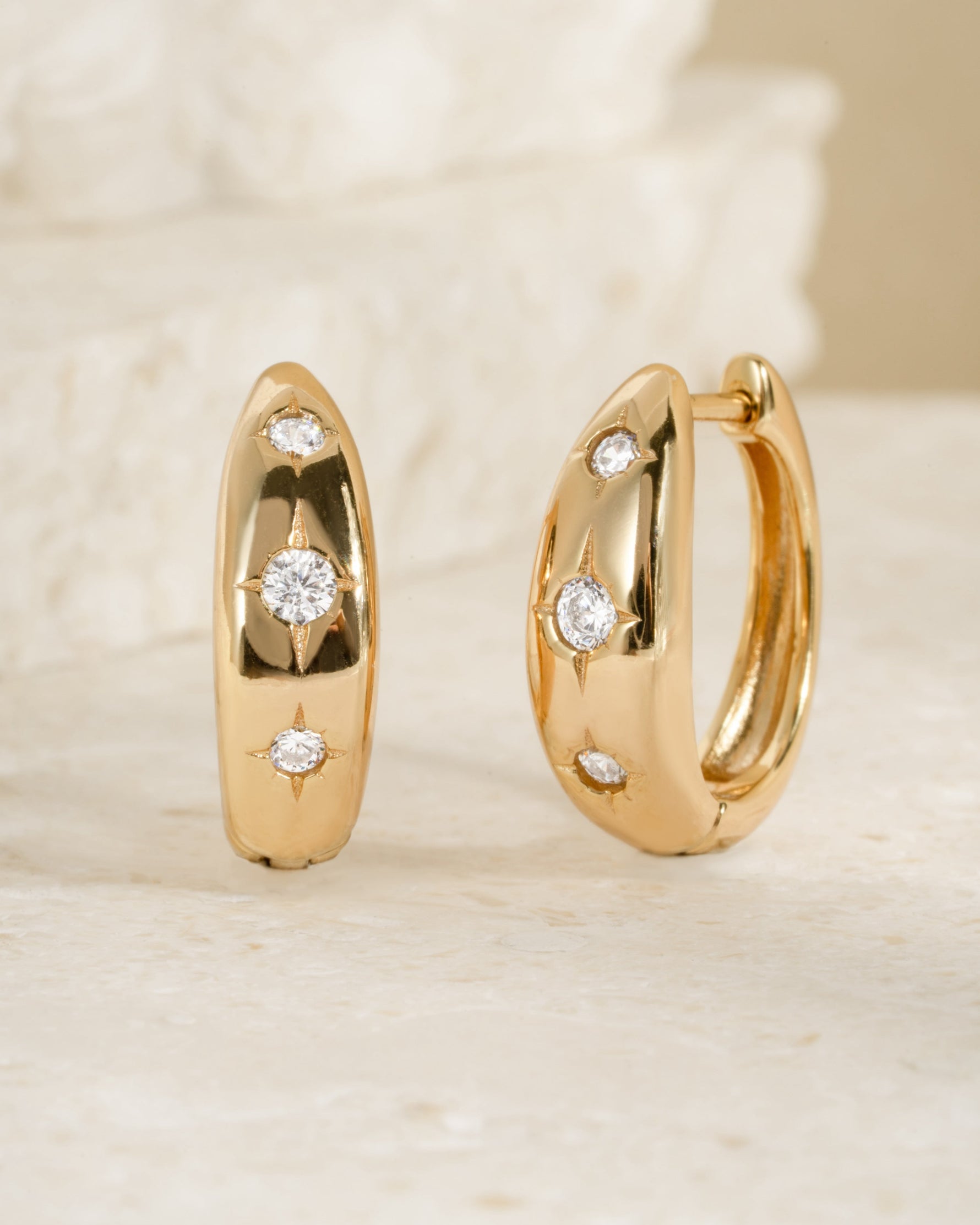 Small gold star earrings 