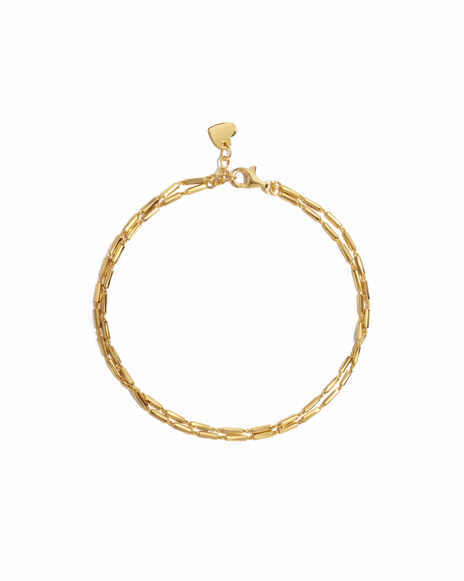 Closeup image of dainty gold bracelet set 